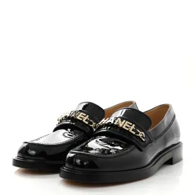 CHANEL SHINY PATENT CALFSKIN LOGO LOAFERS