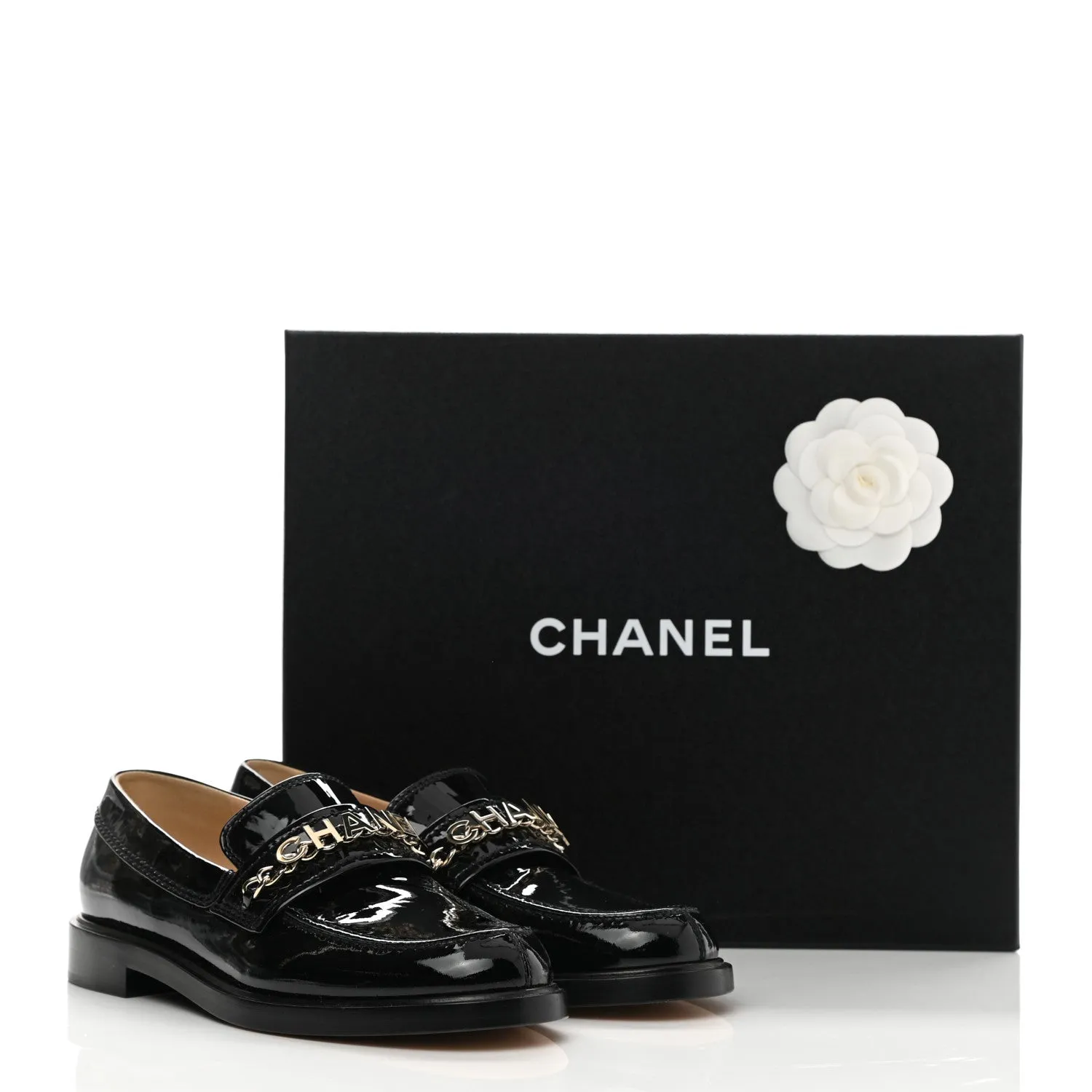 CHANEL SHINY PATENT CALFSKIN LOGO LOAFERS